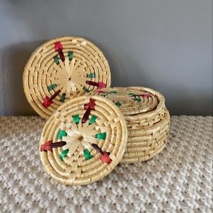 Multicoloured woven coasters in case